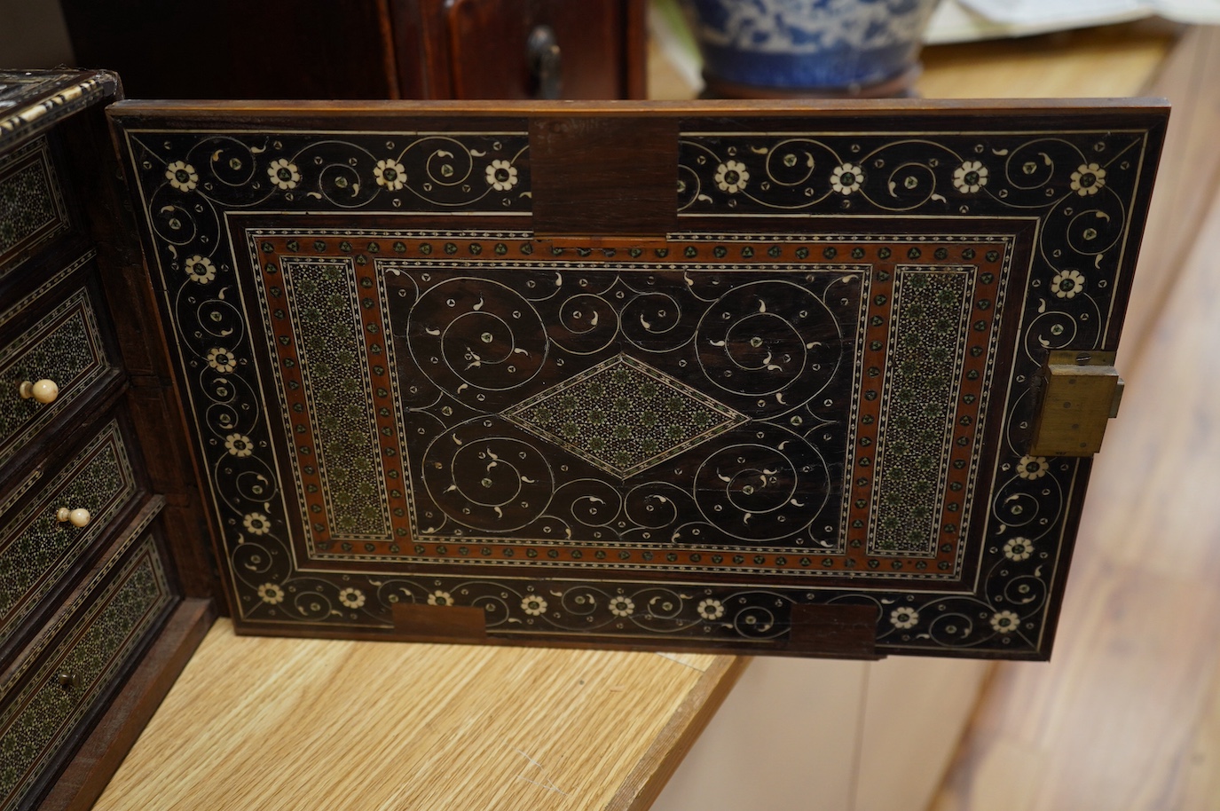 An early 17th century Indo-Portuguese ivory inlaid table cabinet, Gujarat, 29cm high. Condition - poor, losses CITES Submission reference 3XBFQXPT